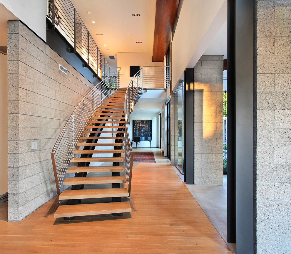 Photo of a contemporary staircase in Orange County with open risers.