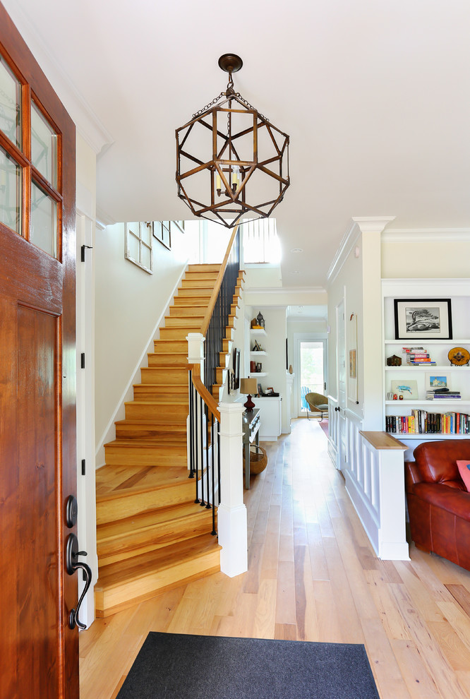 Inspiration for a mid-sized timeless wooden straight staircase remodel in Charleston with wooden risers