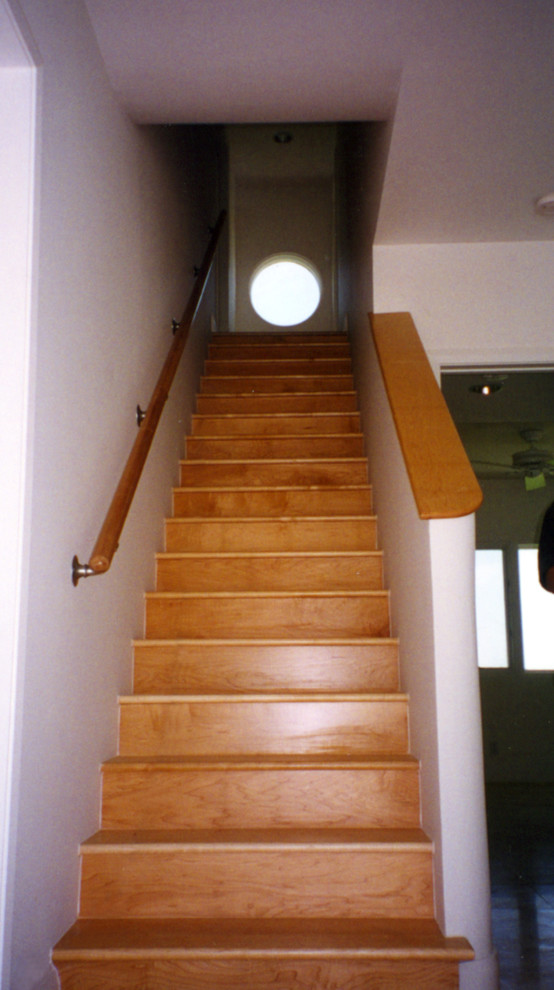 Example of a mid-sized tuscan wooden u-shaped staircase design in Miami with wooden risers