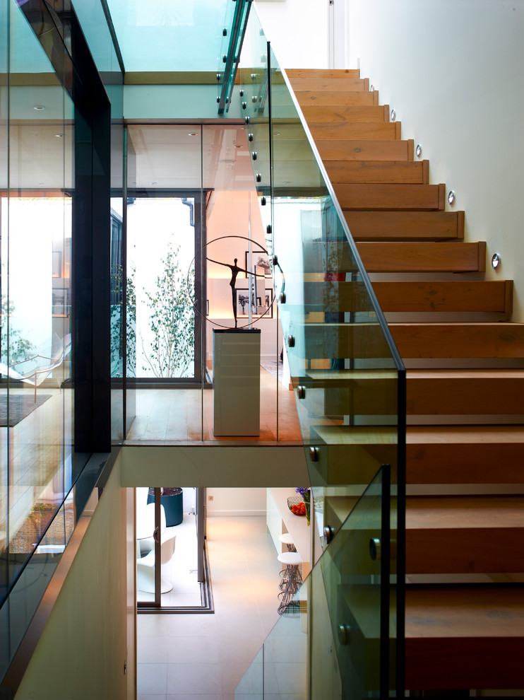 Design ideas for a large contemporary wood u-shaped staircase in Other with open risers.