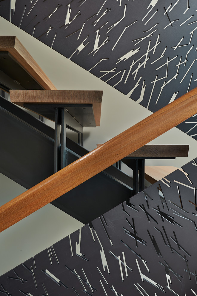 Inspiration for a large contemporary wood u-shaped staircase in Seattle with open risers.