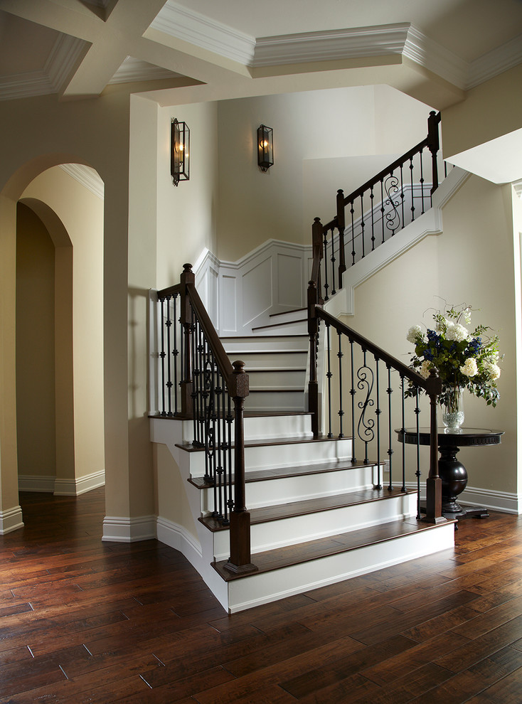 Traditional wood curved mixed railing staircase in Tampa with painted wood risers.