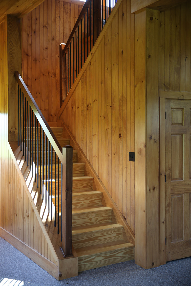 Exemple d'un escalier chic en L de taille moyenne avec des marches en bois et des contremarches en bois.