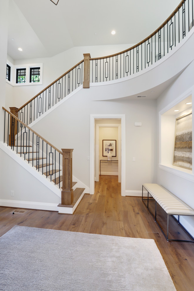 Example of a large trendy wooden u-shaped mixed material railing staircase design in Seattle with painted risers