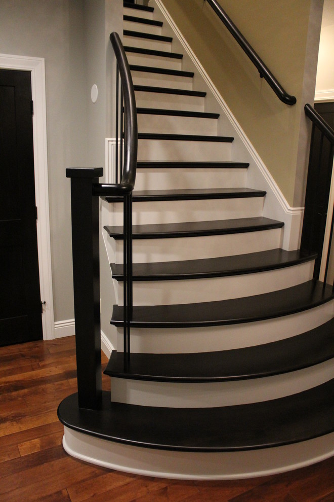 Contemporary wood straight staircase in Cleveland with wood risers.