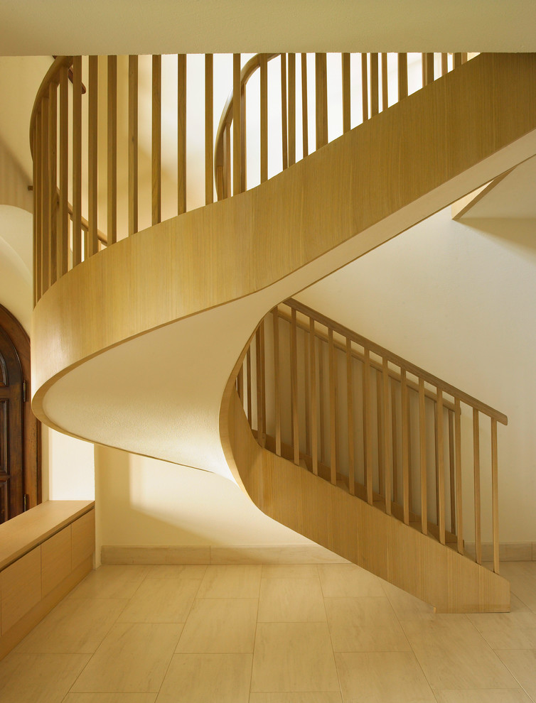 Design ideas for a mediterranean wood railing staircase in Milan.