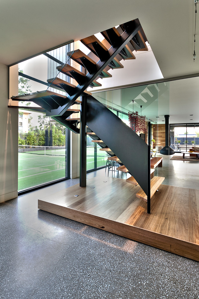 Источник вдохновения для домашнего уюта: угловая лестница среднего размера в современном стиле с деревянными ступенями без подступенок