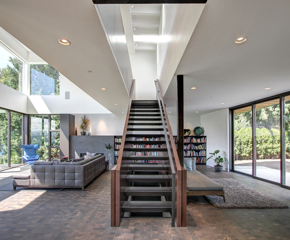 Photo of a large contemporary straight staircase in Seattle with open risers.