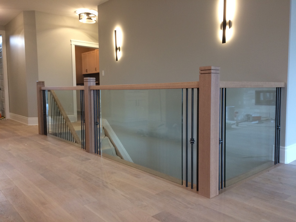 Metal and glass railing. Contemporary Staircase Toronto by TFP