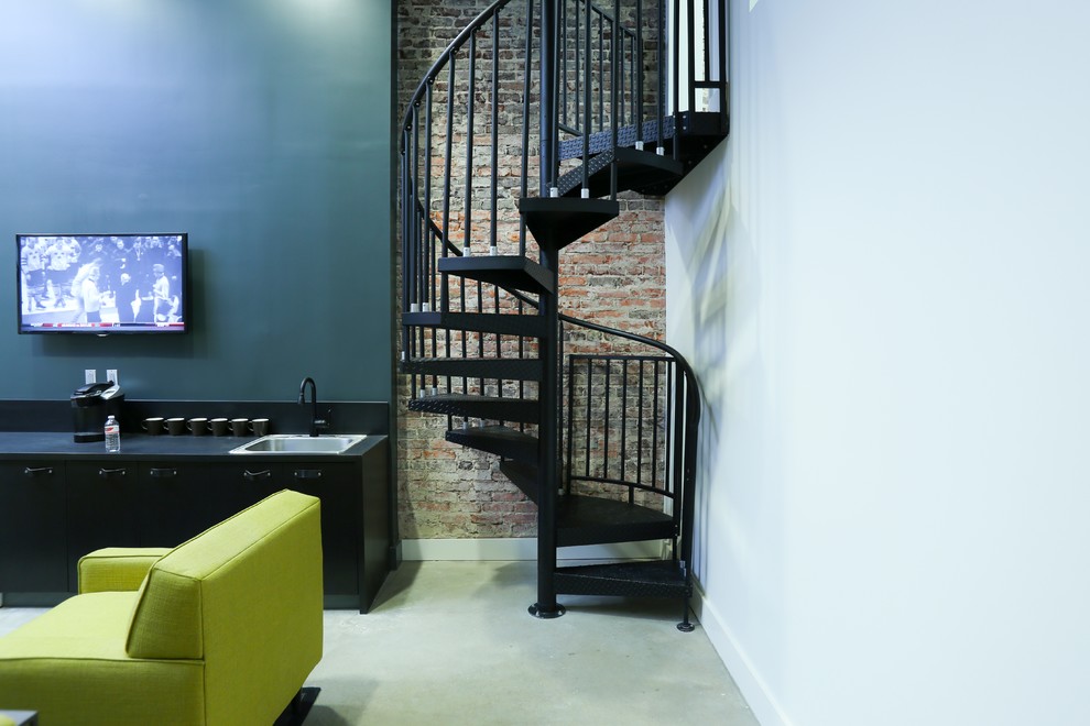 Photo of a small modern metal spiral staircase in Philadelphia with open risers.