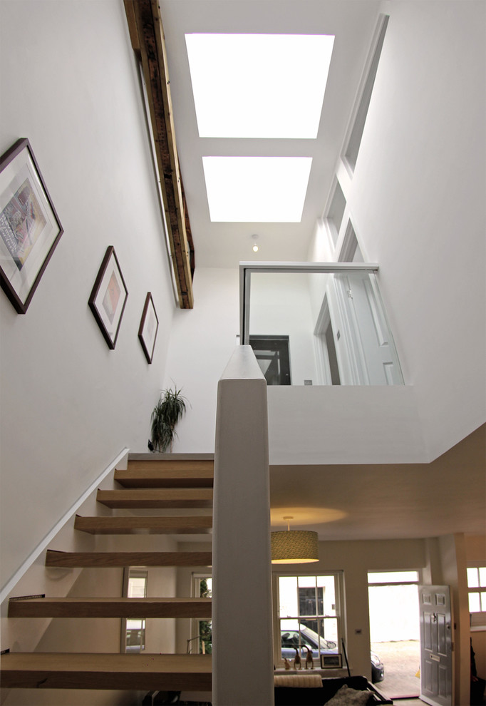 Staircase - small contemporary wooden u-shaped open staircase idea in London