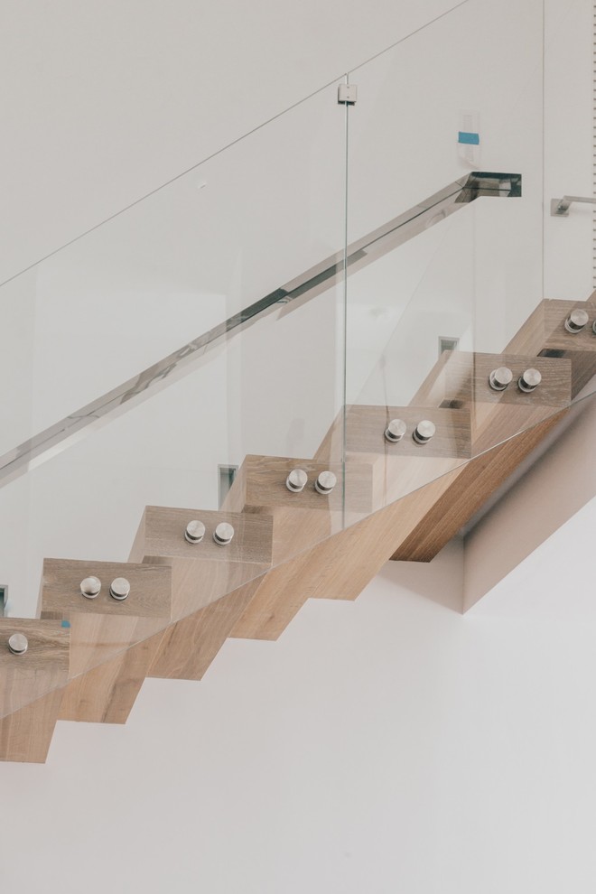 Photo of a contemporary wood staircase in New York.