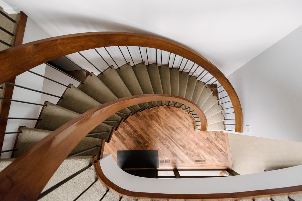 Photo of a contemporary carpeted curved staircase in Salt Lake City with open risers.