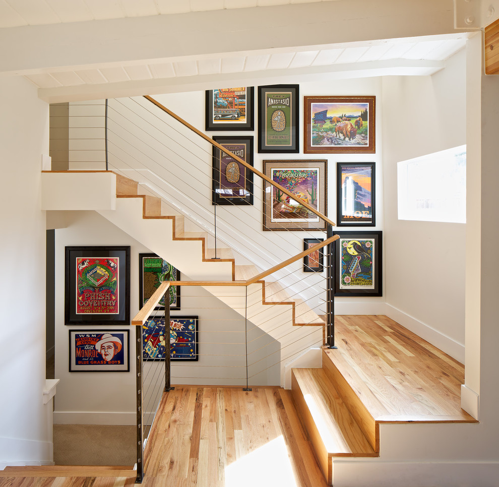 Inspiration for a mid-sized modern wooden u-shaped staircase remodel in Denver with wooden risers
