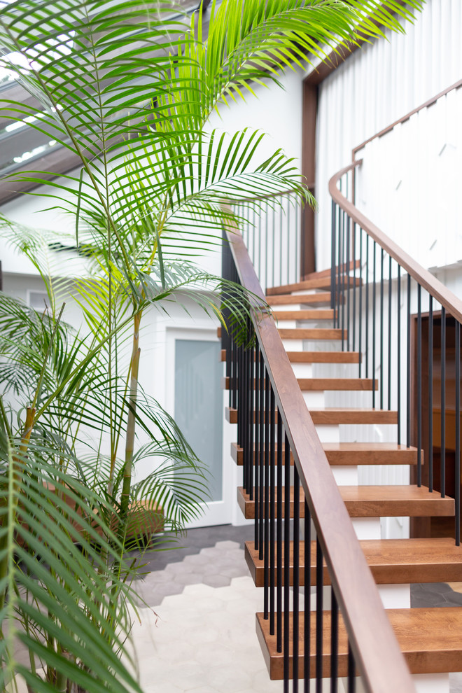Idée de décoration pour un escalier sans contremarche flottant vintage de taille moyenne avec des marches en bois et un garde-corps en matériaux mixtes.