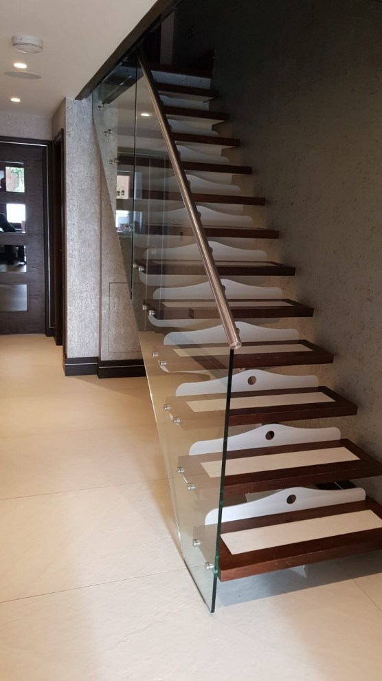 Staircase - small contemporary wooden straight open and glass railing staircase idea in London