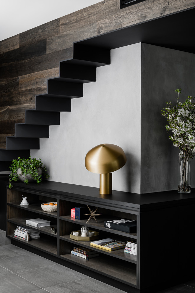 This is an example of a contemporary staircase in Melbourne with feature lighting.