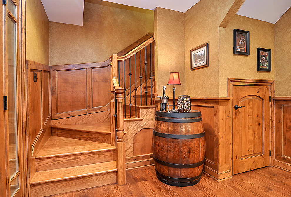 Foto de escalera en L rústica grande con escalones de madera y contrahuellas de madera