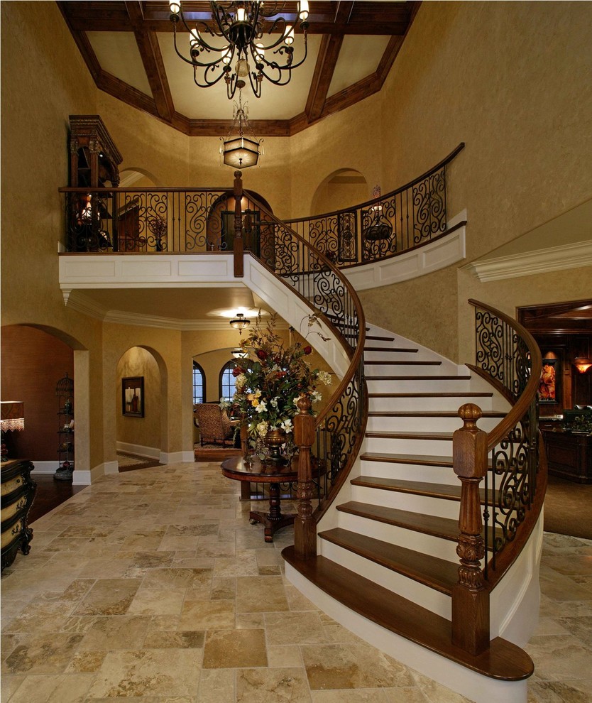 Photo of a medium sized rustic wood curved metal railing staircase in Chicago with painted wood risers.