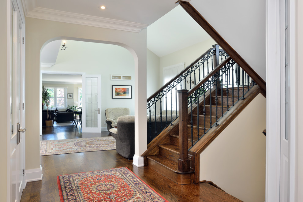Design ideas for a traditional wood l-shaped staircase in Toronto with wood risers.
