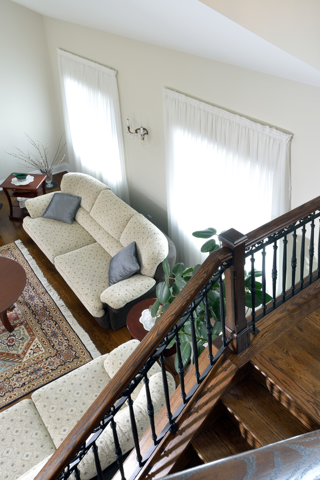 Example of a mid-sized classic wooden l-shaped staircase design in Toronto with wooden risers