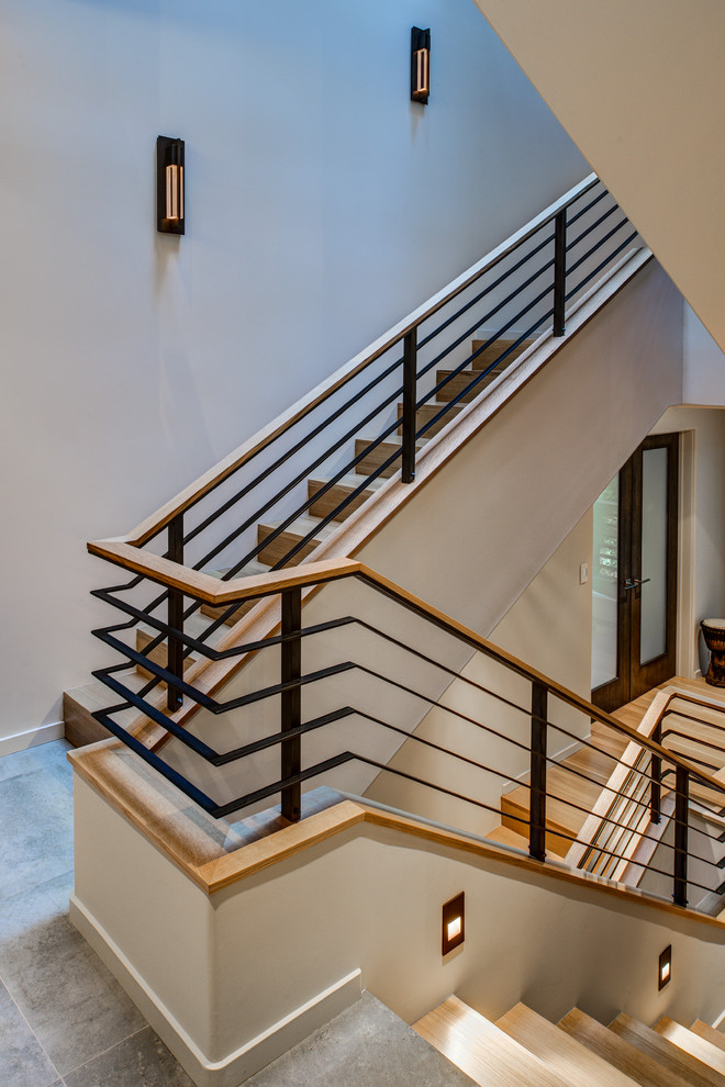 Trendy wooden u-shaped staircase photo in San Francisco with wooden risers