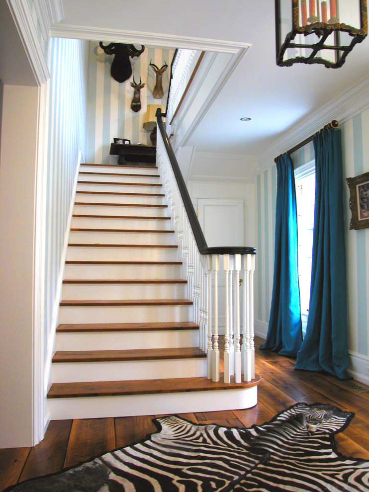 Design ideas for a farmhouse staircase in New York with feature lighting.