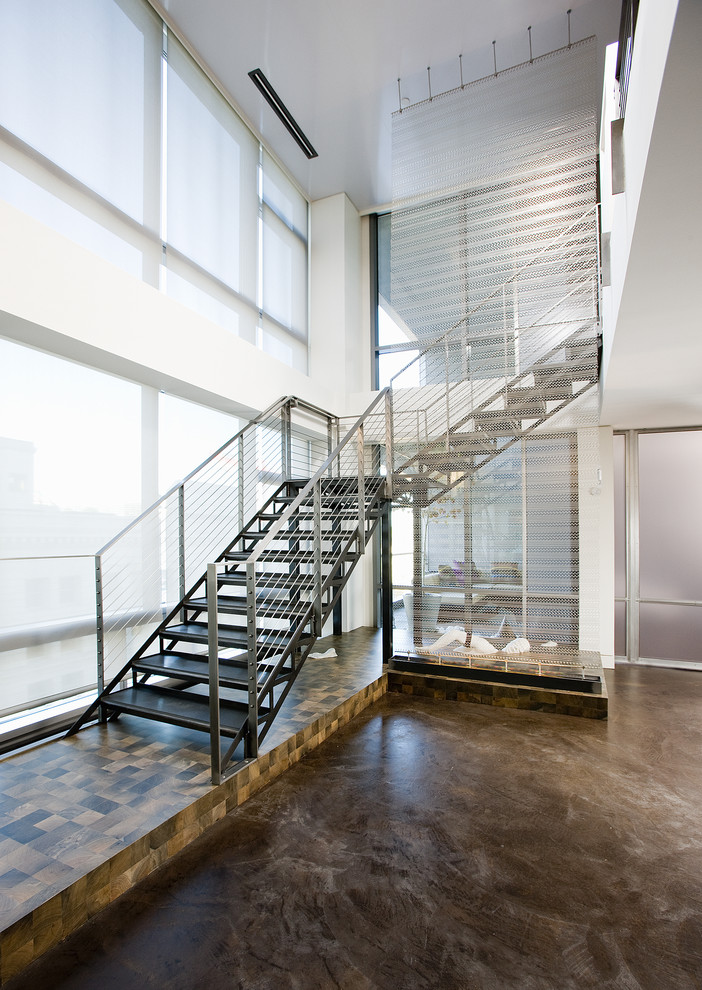 Contemporary l-shaped staircase in Seattle with open risers.