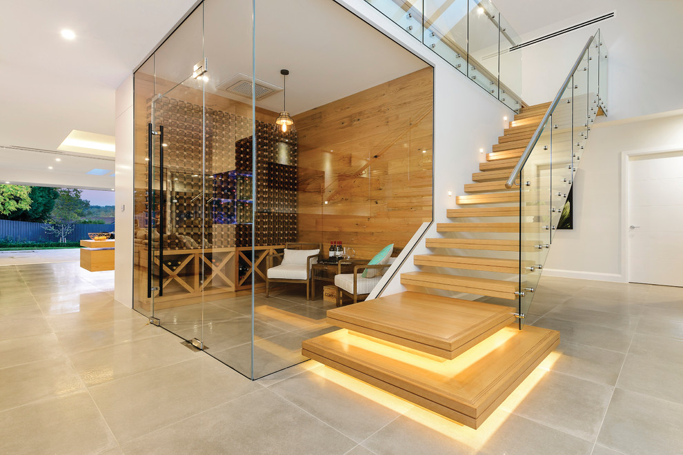 Ejemplo de escalera recta contemporánea de tamaño medio sin contrahuella con escalones de madera