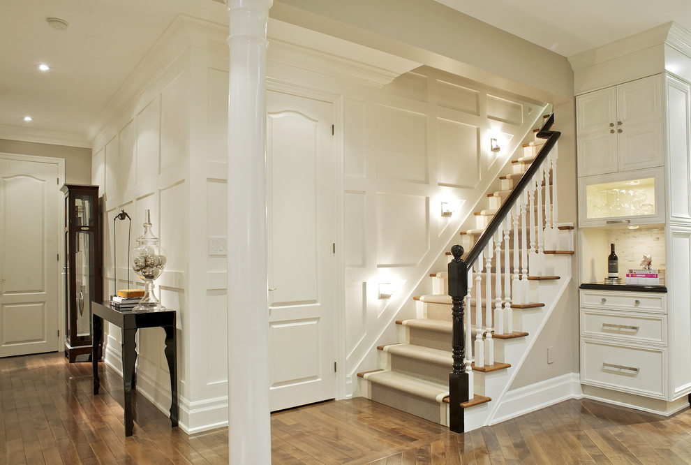 Design ideas for a medium sized contemporary wood straight staircase in Toronto with painted wood risers.