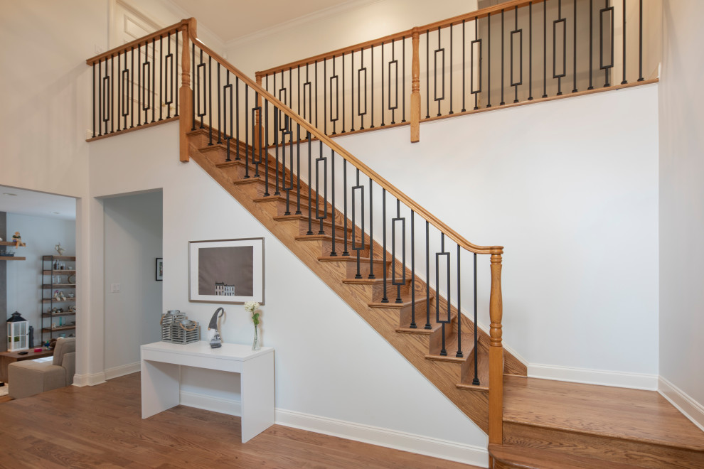 Small trendy wooden l-shaped metal railing staircase photo in New York with wooden risers