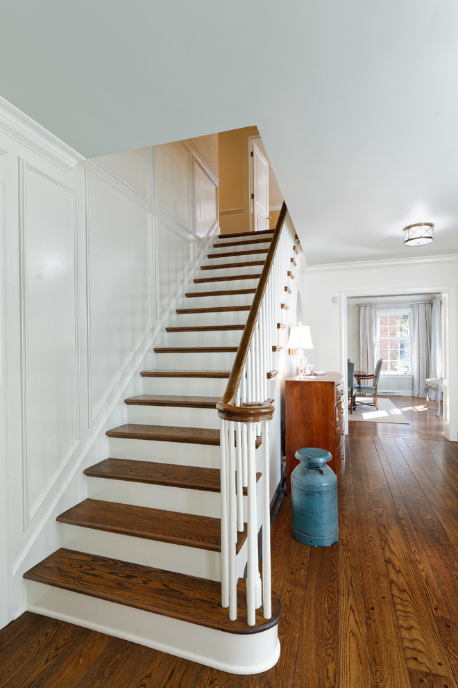 Inspiration for a timeless wooden straight wood railing staircase remodel in Cincinnati with painted risers