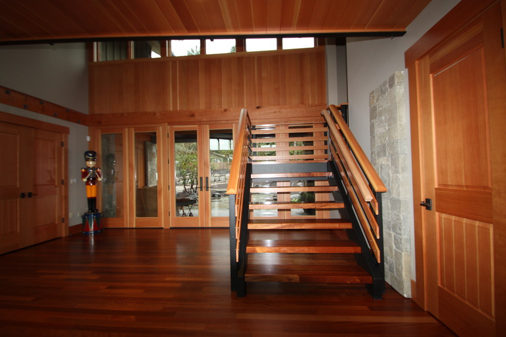 Photo of a traditional wood staircase in Portland with open risers.