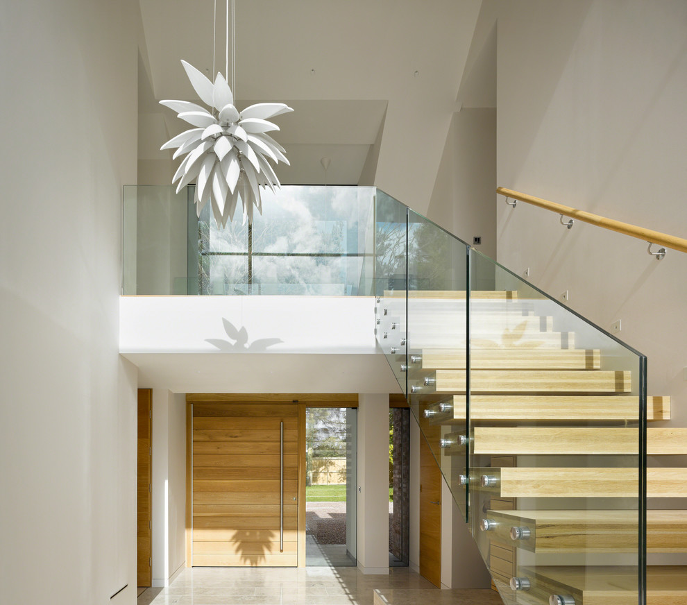 Contemporary wood straight staircase in Manchester with open risers.