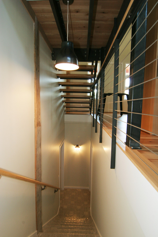 Example of a mid-sized urban wooden straight open staircase design in Grand Rapids