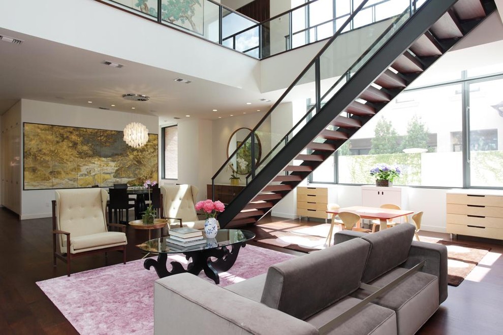 Inspiration for a large contemporary wood straight staircase in Houston with open risers.