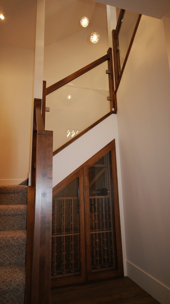 Inspiration for a medium sized contemporary carpeted staircase in Calgary with carpeted risers.