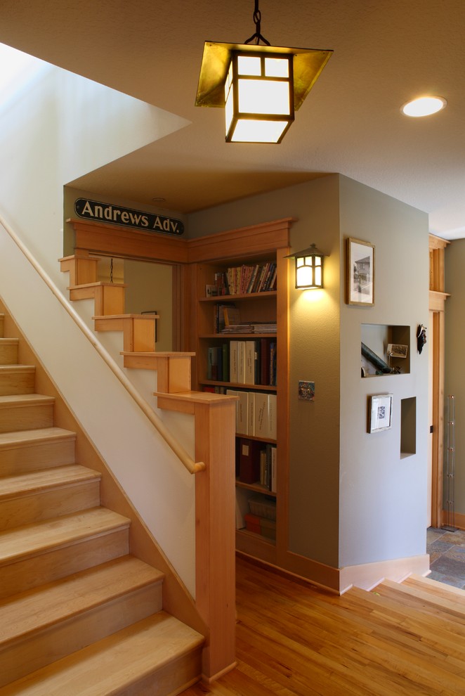 Inspiration for a large craftsman wooden straight staircase remodel in Portland with wooden risers