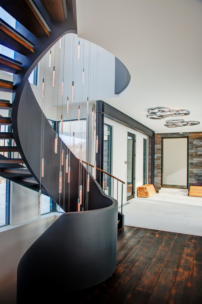 Inspiration for a contemporary wooden curved open staircase remodel in New York