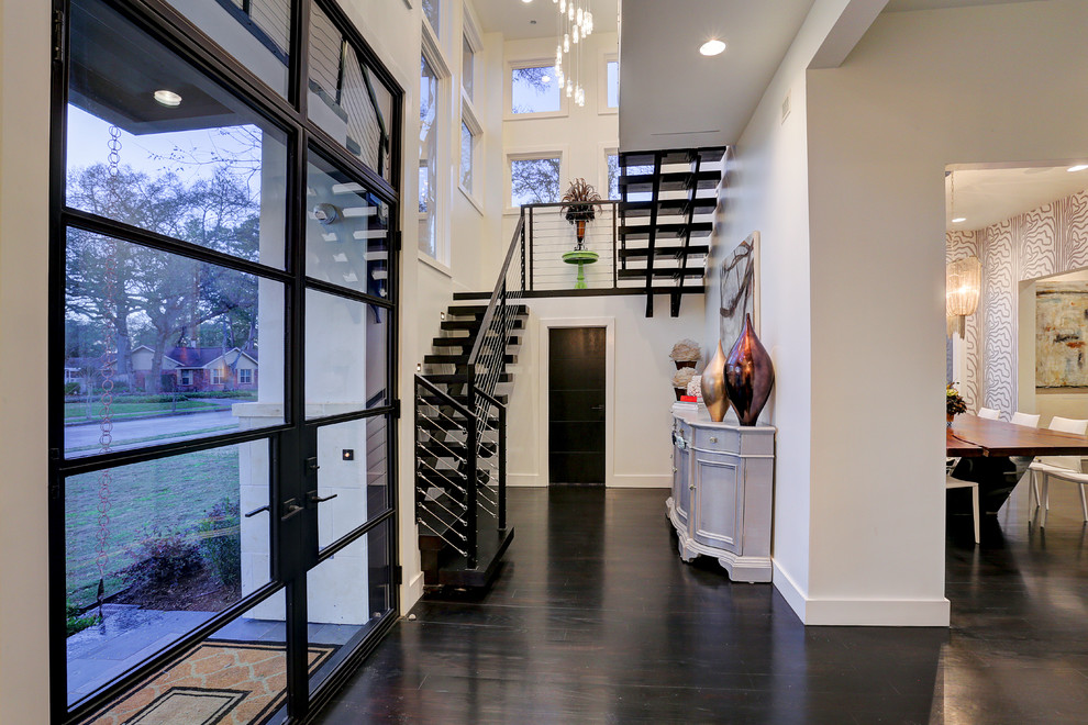Inspiration for a medium sized modern wood floating wire cable railing staircase in Houston with open risers.