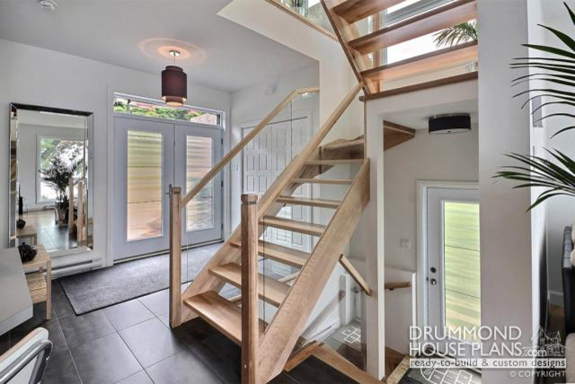 Inspiration for a contemporary wooden u-shaped staircase remodel in Other with wooden risers