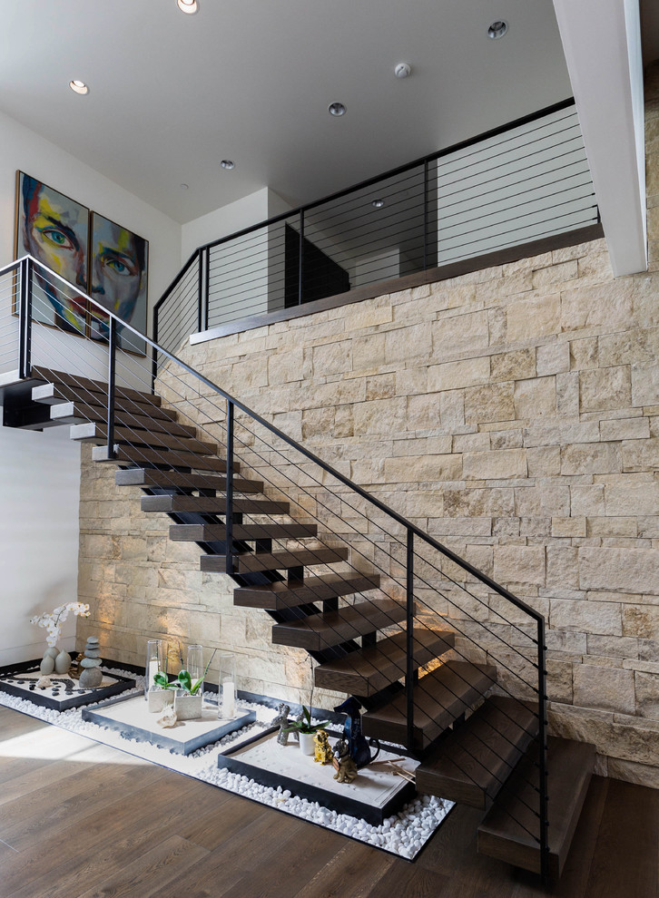 Example of a trendy wooden floating open and cable railing staircase design in Seattle
