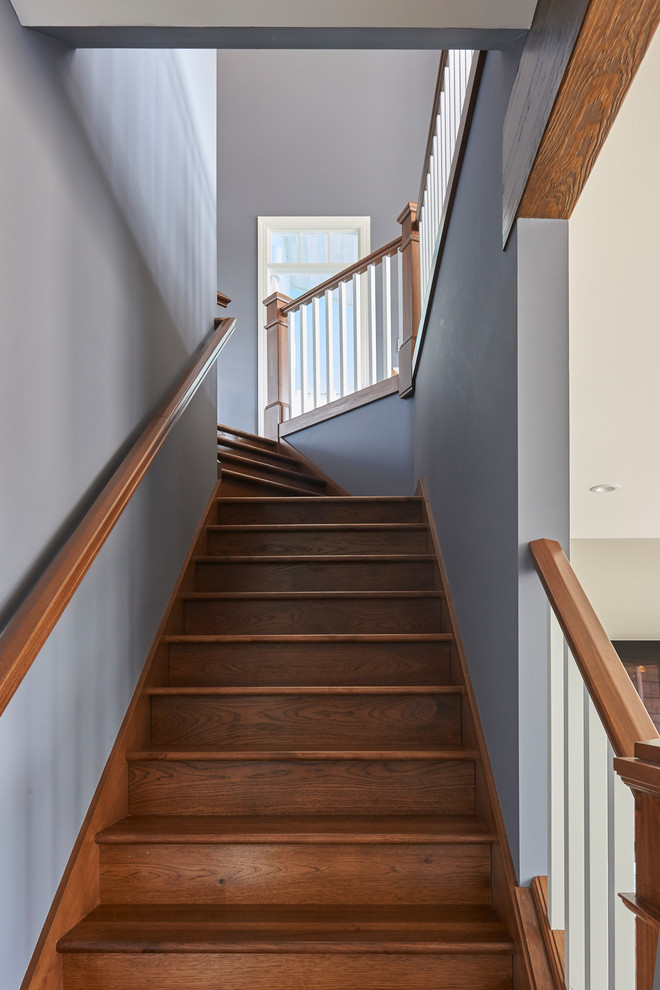 Inspiration for a mid-sized timeless wooden straight wood railing staircase remodel in Grand Rapids with wooden risers