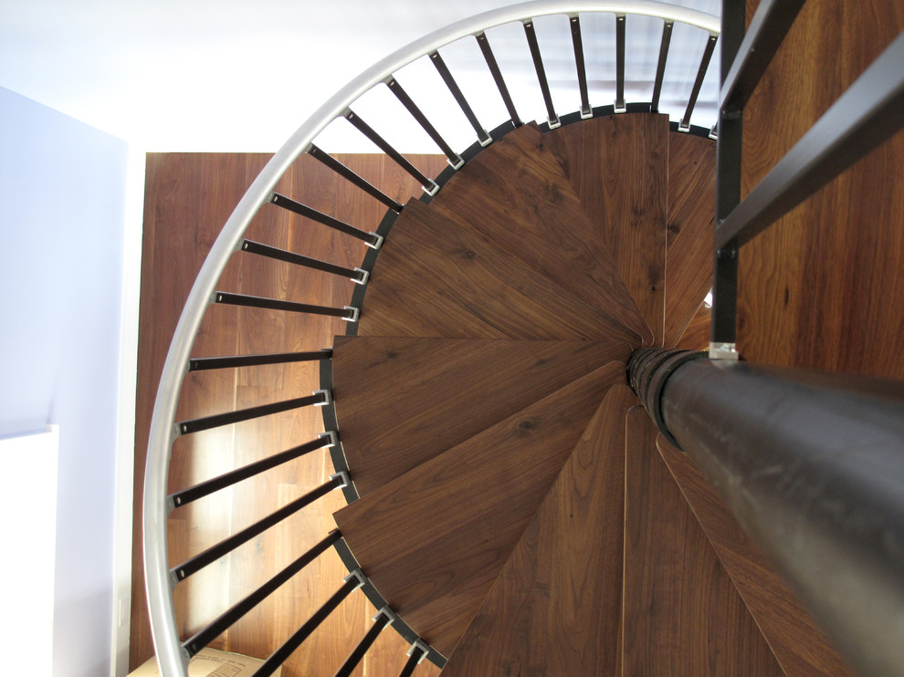 Inspiration for a mid-sized country wooden spiral open staircase remodel in Richmond