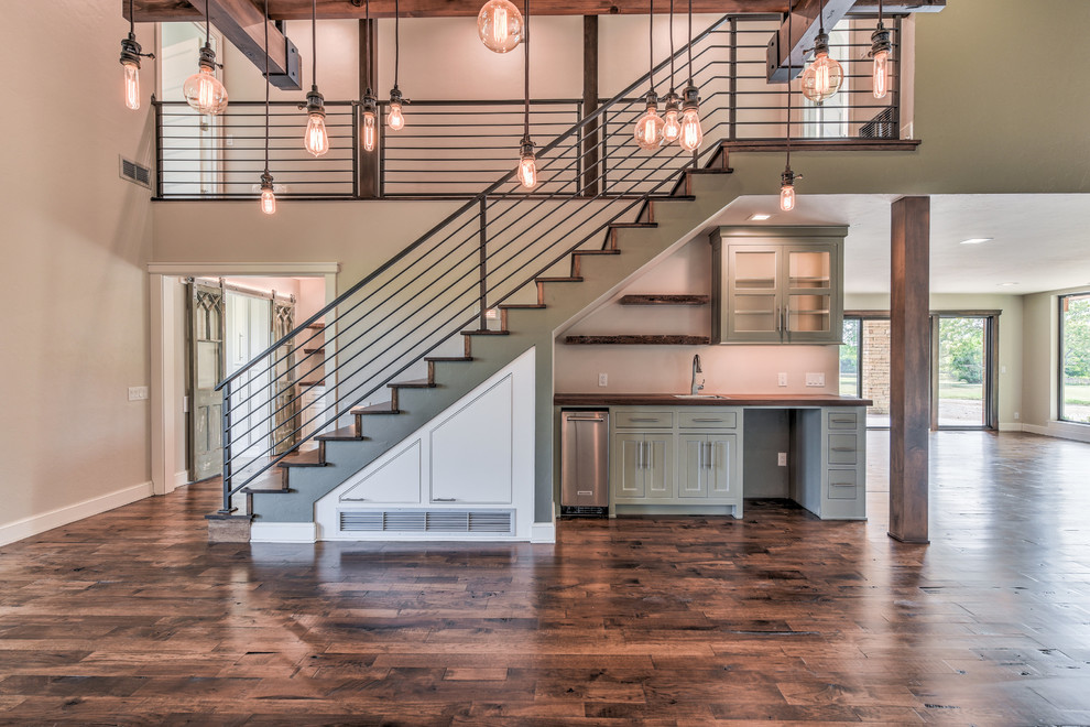 Staircase - mid-sized cottage wooden straight metal railing staircase idea in Oklahoma City with wooden risers