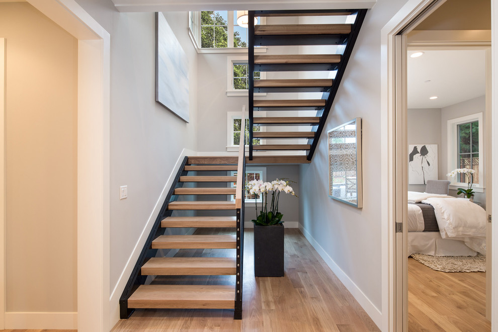 Farmhouse wood floating staircase in San Francisco with open risers.