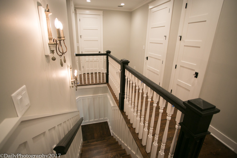 Design ideas for a farmhouse wood l-shaped wood railing staircase in Dallas with wood risers.