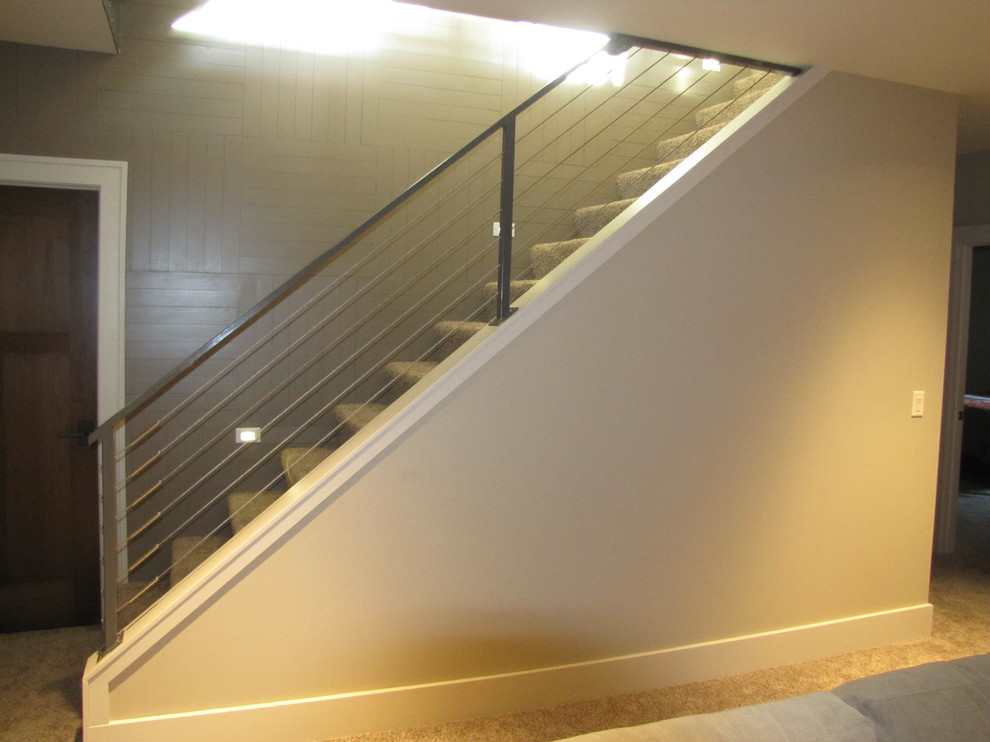 Example of a mid-sized minimalist wooden straight open staircase design in Orange County