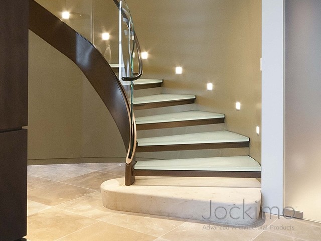 Modern glass curved staircase in Orange County.