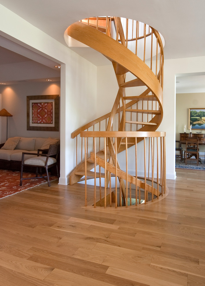 This is an example of a world-inspired staircase in Charleston with feature lighting.